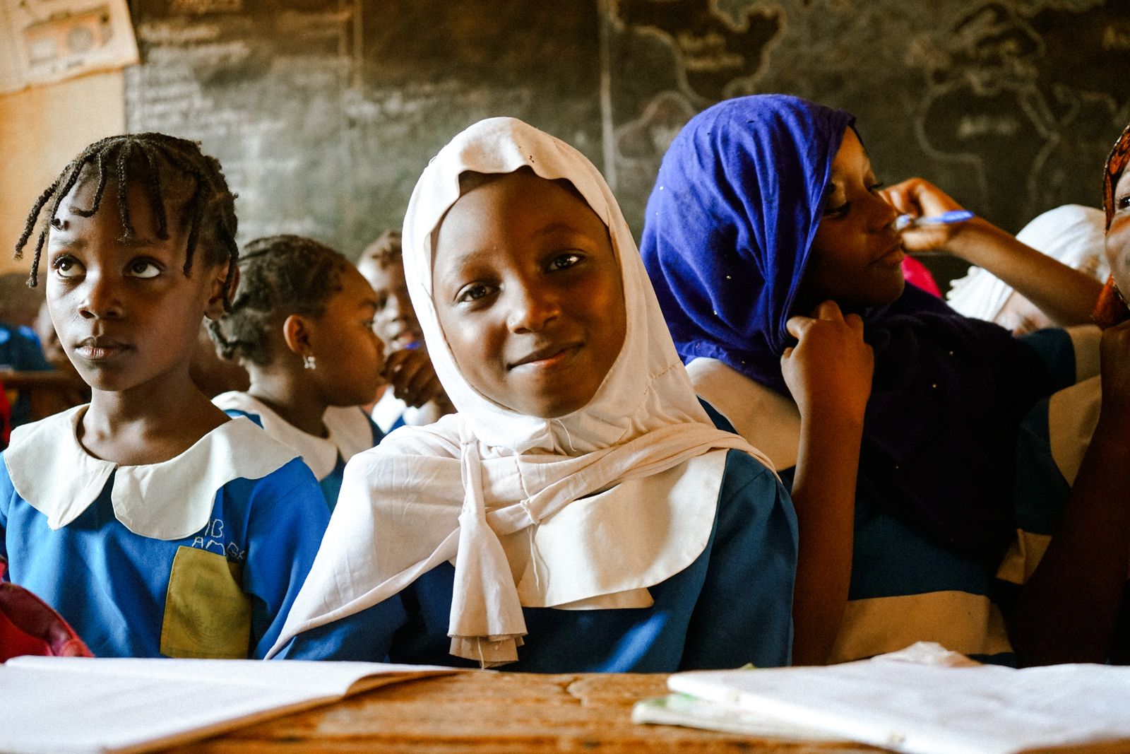 Nigerian secondary school students smiling in class
